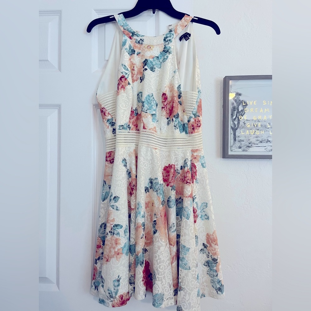 White floral laced short sleeveless dress.